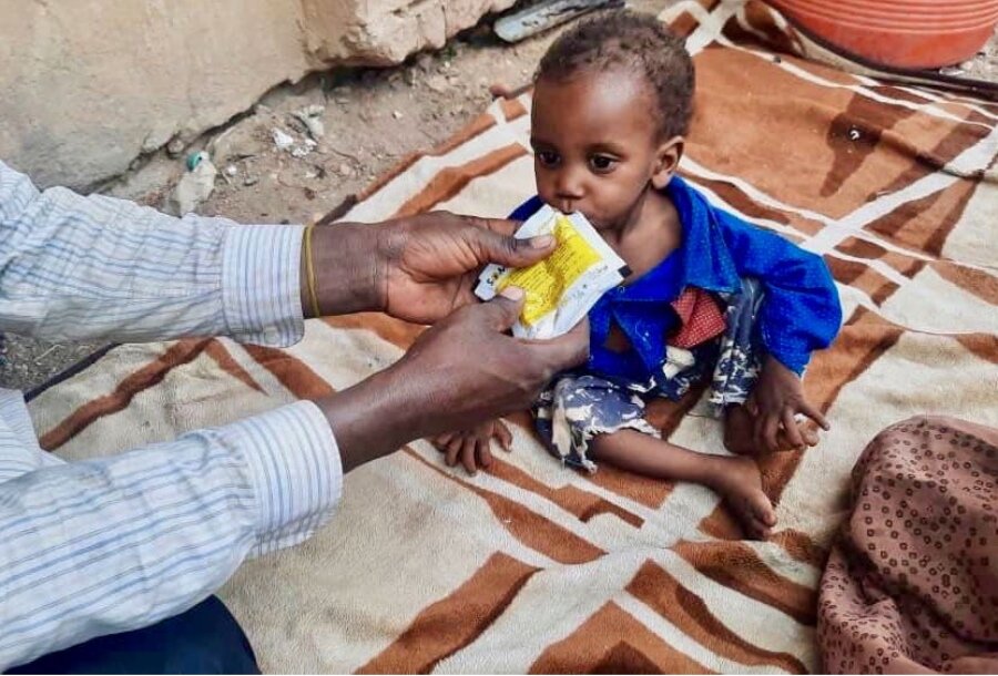 In Sudan's Gezira State, tiny Altahir Hassan Juma receives WFP's peanut-based nutritional supplement to fight malnutrition. Photo: WFP Photolibrary
